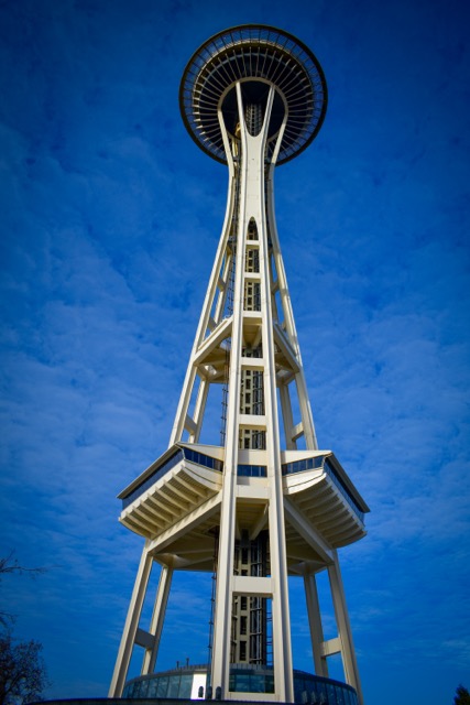 Seattle’s Space Needle rising against a bright blue sky.