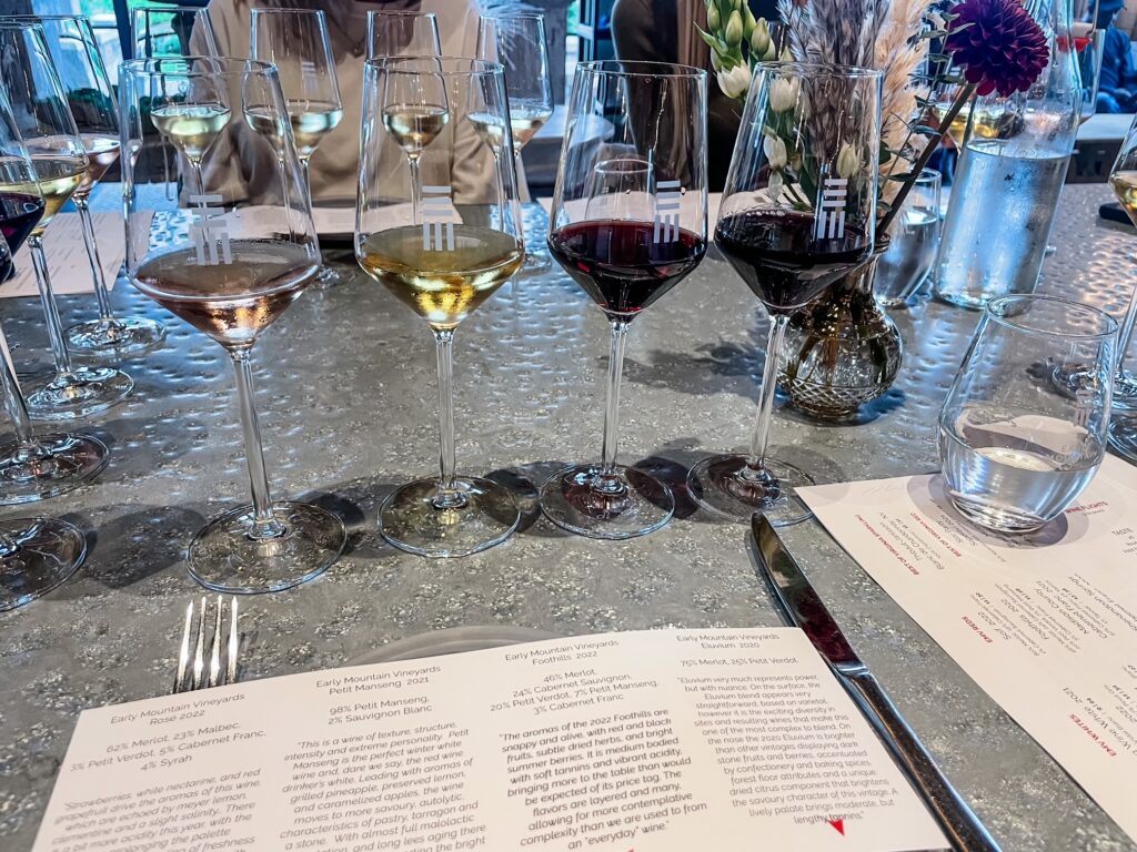 Wine tasting flight with rosé, white, and red wines at Early Mountain Vineyard.