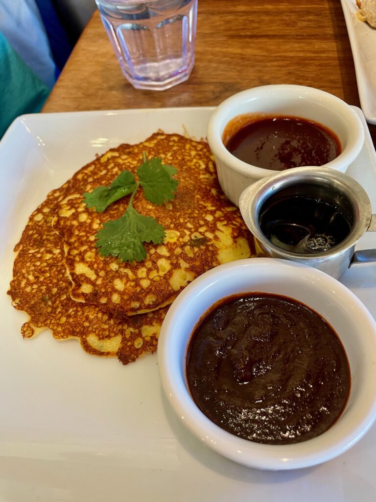 Corn pancakes with syrup and mole sauce served at Café Pasqual’s restaurant in Santa Fe, New Mexico.