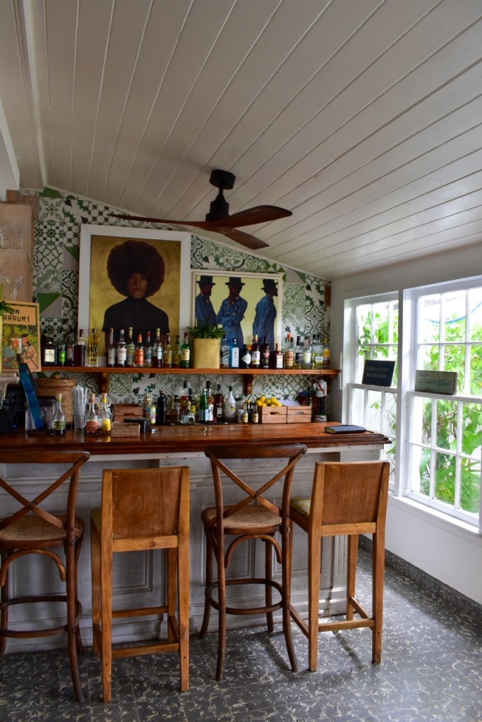Bar area at Ocean View Hotel on Harbour Island, Bahamas, featuring tropical decor and local artwork.