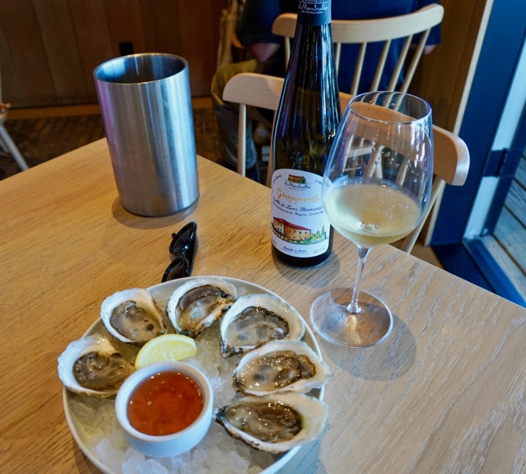 Fresh oysters on ice with mignonette and white wine pairing at Straight Wharf Fish in Nantucket