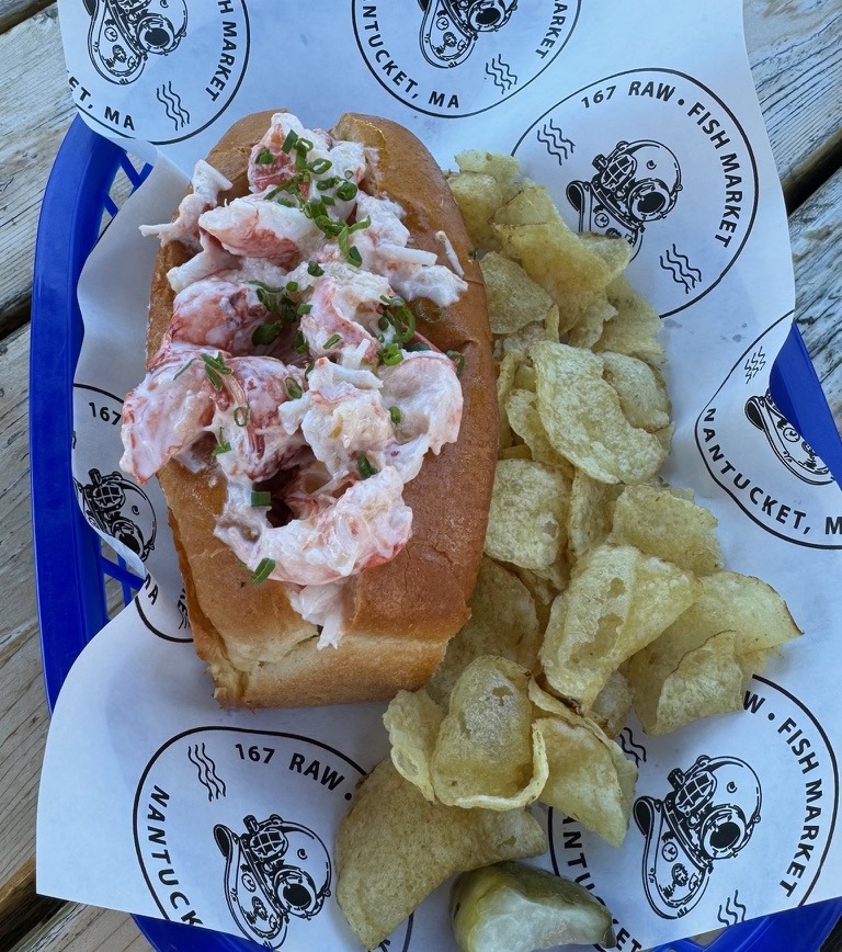 Fresh lobster roll served with kettle chips at 167 Raw Fish Market in Nantucket, Massachusetts